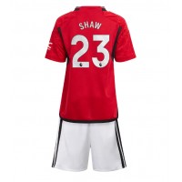 Echipament fotbal Manchester United Luke Shaw #23 Tricou Acasa 2023-24 pentru copii maneca scurta (+ Pantaloni scurti)